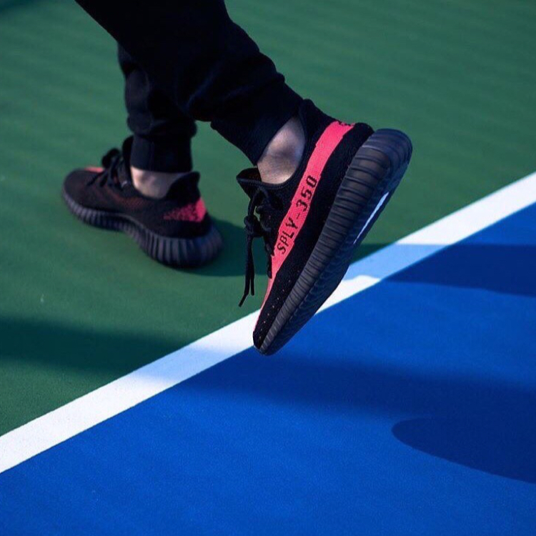 yeezy red on feet